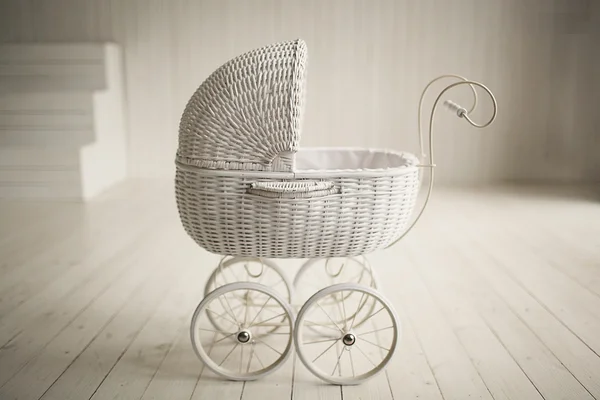 Beautiful old fashioned white pram in white room — Stock Photo, Image