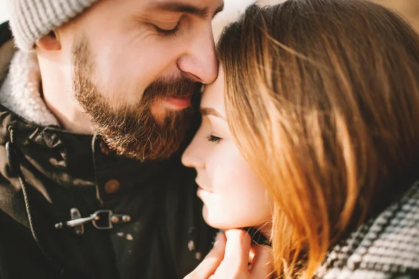 Close-up portrait of hipster couple hugging with closed eyes — Stock Photo, Image