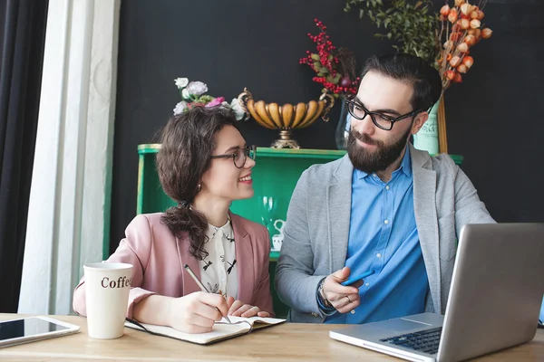 Modern team working in cafe with laptop, smartphone with coffee — Stock Photo, Image
