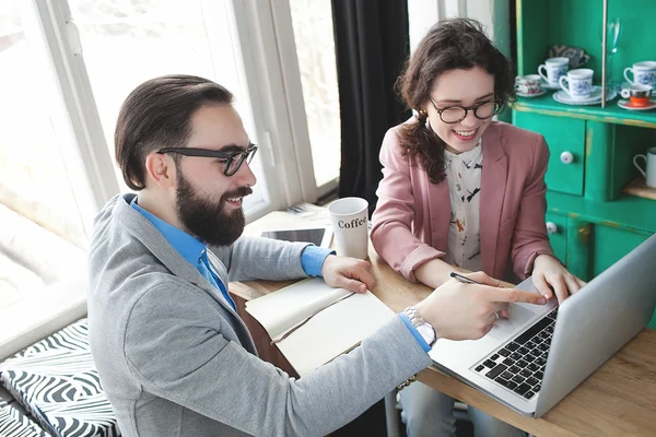 Modern team working in cafe with laptop, smartphone with coffee — Stock Photo, Image