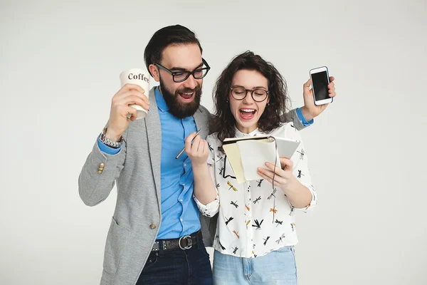 Hipster team with smartphone tablet celebrating success isolated — Stock Photo, Image