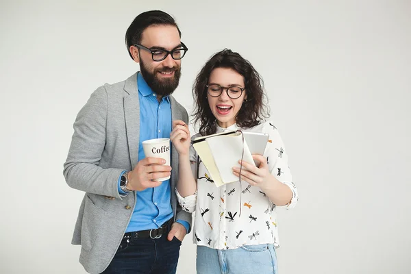 Hipster team with smartphone tablet celebrating success isolated — Stock Photo, Image