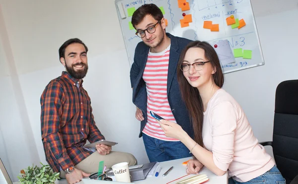 Team of three colleagues working in modern office — Stock Photo, Image