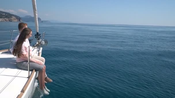 Enamored couple sitting on a yacht — Stock Video