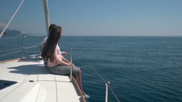 Enamored couple sitting on a yacht — Stock Video