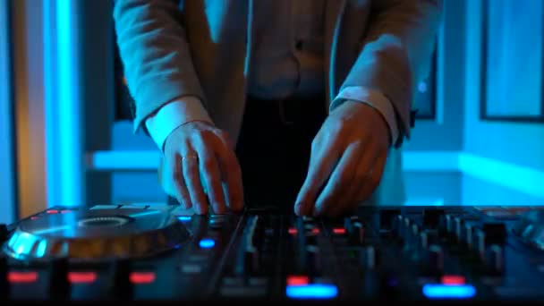 Dj hands on equipment deck — Stock Video