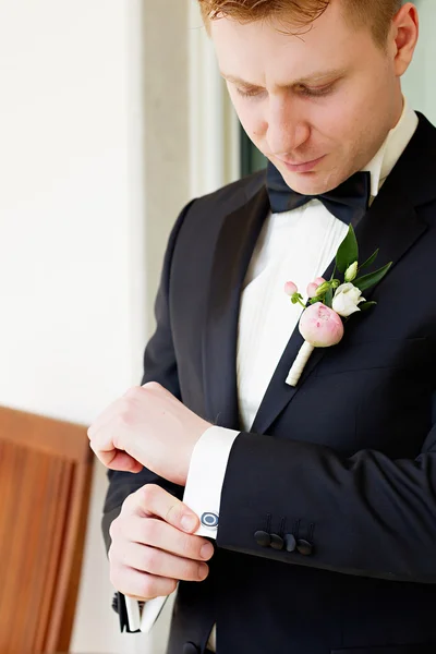 Handsome groom in suit with bow tie — Stock Photo, Image