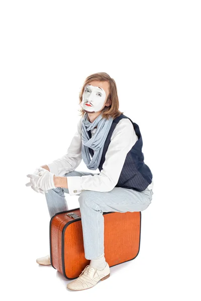 Mime actor sitting on suitcase — Stock Photo, Image