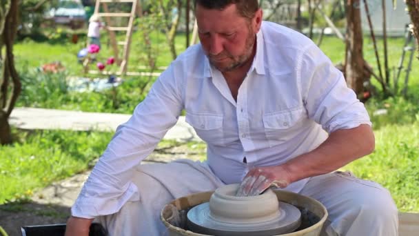 Hands of a potter, creating a clay jar — Stock Video