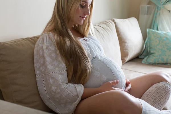 Pregnant woman stroking her belly — Stock Photo, Image