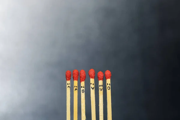 Group of a red match burning isolated with the background. Row burning matchstick in the chain reaction. Matchstick art photography.