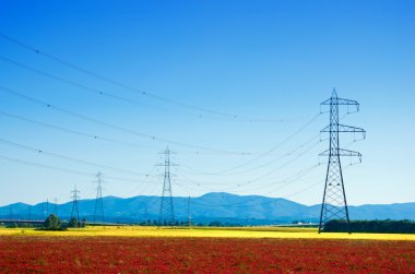 giant electricity pylons in the countryside clipart
