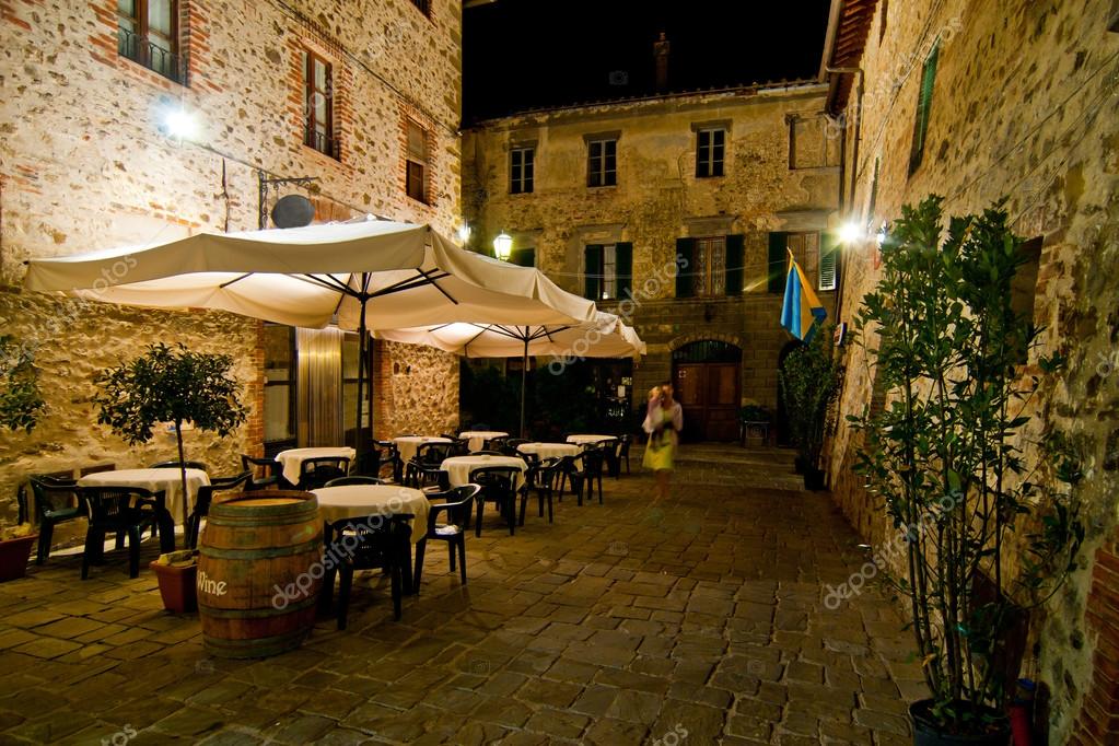 Romantic dinner in small Italian restaurant Stock Photo by ©pmmart