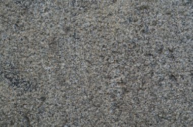 Gri, sert granit. Taşın dokusu..