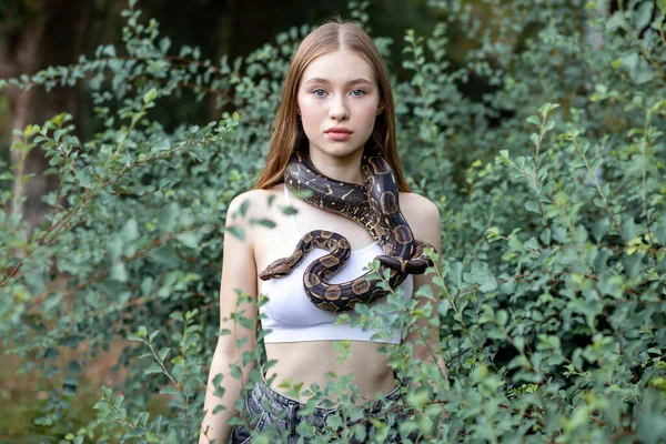 Young Girl Holding Snake Her Neck Standing Bush Portrait Concept ストック写真