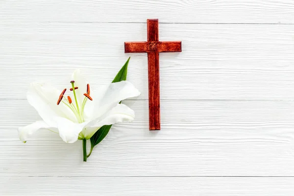 Lily funeral flower with cross. Condolence card with copy space