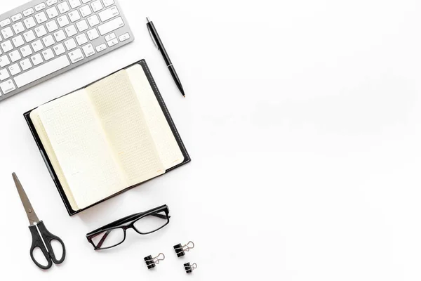 Flat lay workplace office desktop with keyboard and office supplies