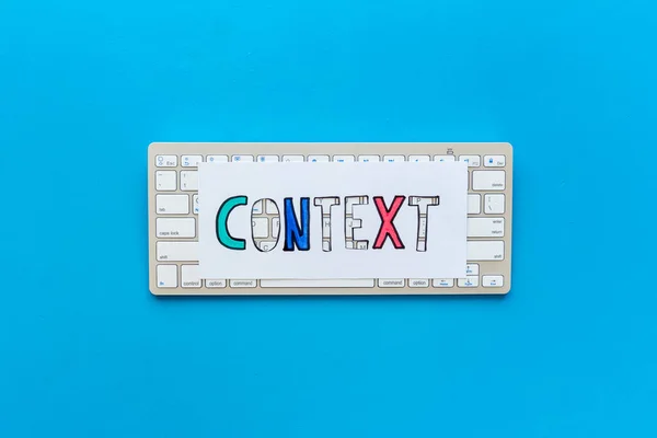 Context online advertising concept. Word Context on the keyboard, top view