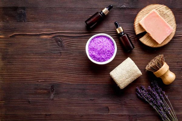 Skin care beauty treatment - lavender bath salt and essential oil, top view