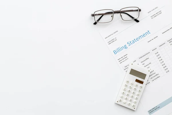 Calculator on financial medical billing statement