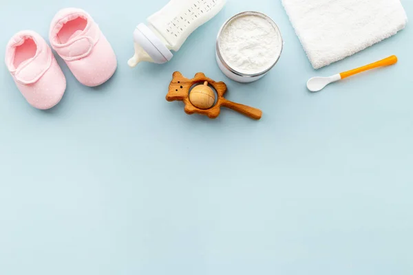 Baby bottle milk formula and powdered milk in a jar for baby feeding