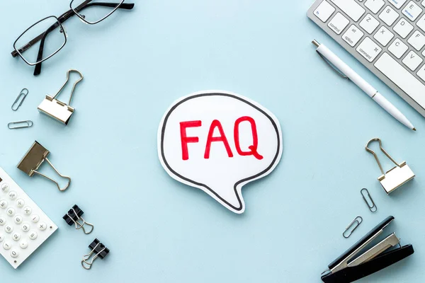 Faq - frequently asked questions - text on paper bubble, top view