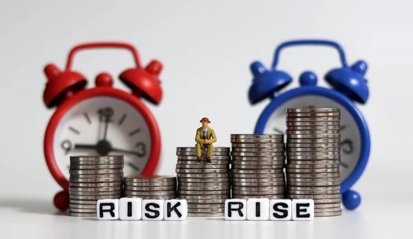 White Cube Bearing Word Risk Word Rise Miniature Man Sitting — Stock Photo, Image