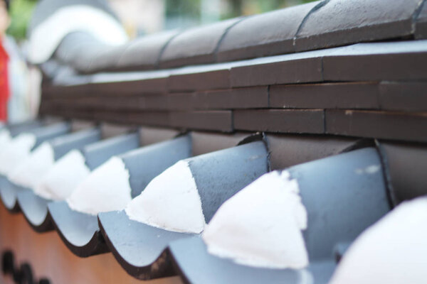 close-up image of the tip of a traditional house eaves in Korea.