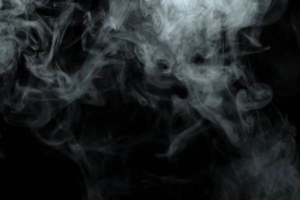 Siyah arkaplanda izole edilmiş soyut toz veya duman etkisi
