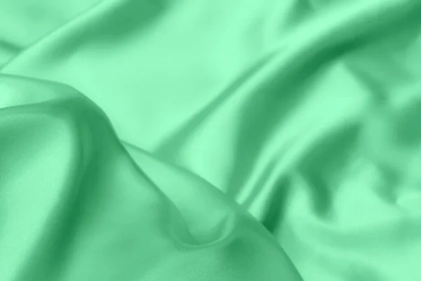 Zöld Szatén Szövet Textúra Puha Elmosódott Háttér — Stock Fotó