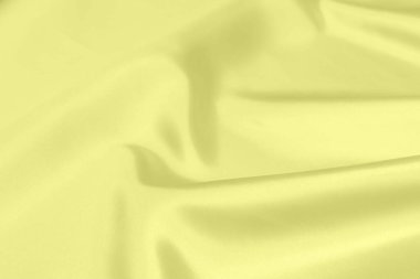 Sarı saten kumaş dokusu yumuşak bulanık arkaplan