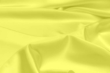 Sarı saten kumaş dokusu yumuşak bulanık arkaplan