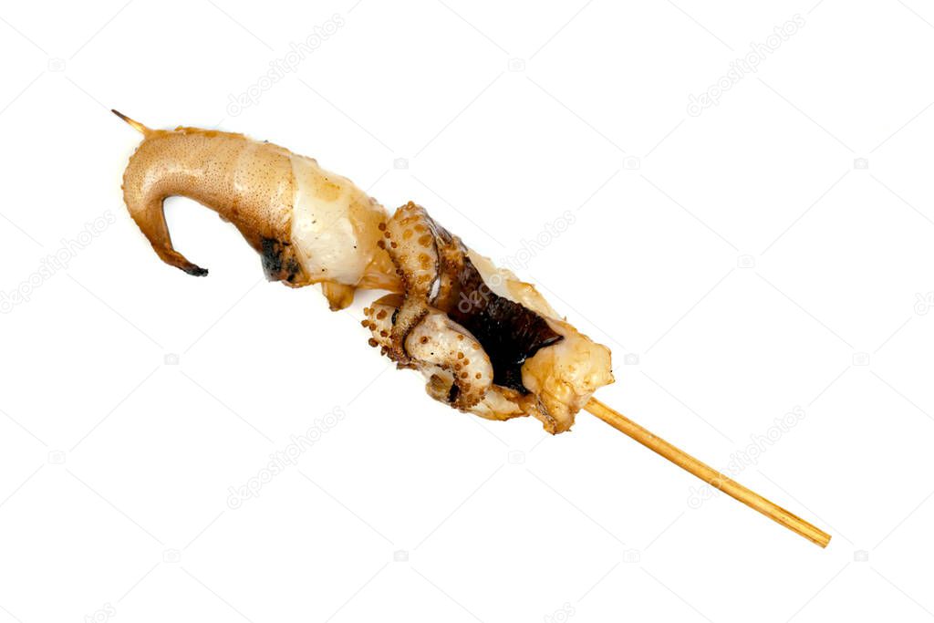 roast tentacles of squid with skewer isolated on white background