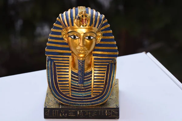 Ceramic souvenir representing the Mask of Tutankhamun a gold mask of the Egyptian pharaoh Tutankhamun. It was discovered by Howard Carter in 1925 in the Tomb of the Valley of the Kings, and is now housed in the Egyptian Museum in Cairo.