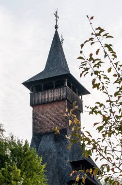 The Maramures wooden church from Barsana belongs to the large family of Romanian wooden churches, with the multiple roof (in steps) narrow but high, with long towers at the western end of the church