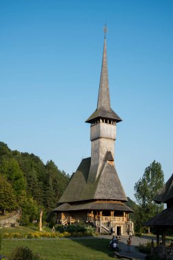 The Maramures wooden church from Barsana belongs to the large family of Romanian wooden churches, with the multiple roof (in steps) narrow but high, with long towers at the western end of the church