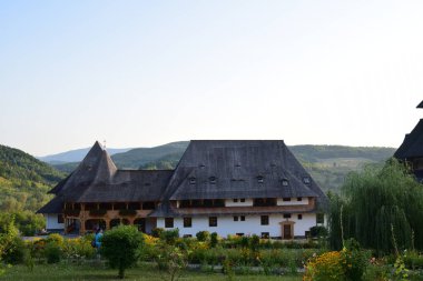 Barsana Orthodox Abbess, a multi-storey building in the Maramures style of wooden churches, with multiple roofs, beautifully decorated, in traditional style, intended for monastic rule 