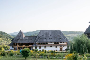 Barsana Orthodox Abbess, a multi-storey building in the Maramures style of wooden churches, with multiple roofs, beautifully decorated, in traditional style, intended for monastic rule 