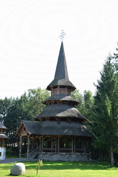 The summer altar from the Sapanta Peri Monastery - a wooden construction in Maramures style with a multi-storey roof made of wooden shingles, here the services take place on hot summer days