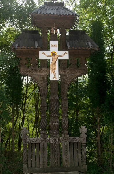 The cross at the side of the road is carved out of wood, with motifs in which the Orthodox cross and solar rosettes predominate, is located at forks and road intersections to ward off evil spirits