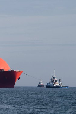 LNG TANKER - Ship at sea assisted by a tug boat and a fireboat clipart