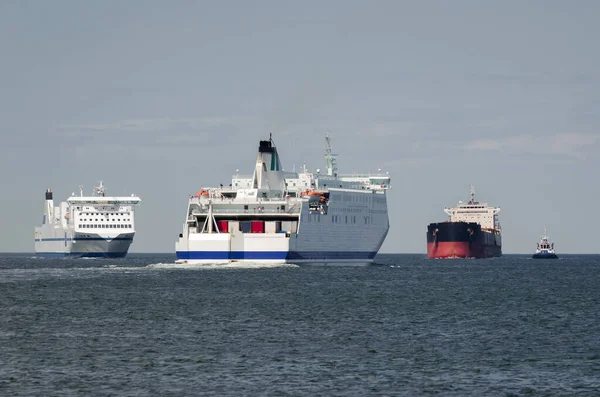 MARITIME TRANSPORT  - Passenger ferrys and bulk carrier on waterway to the port