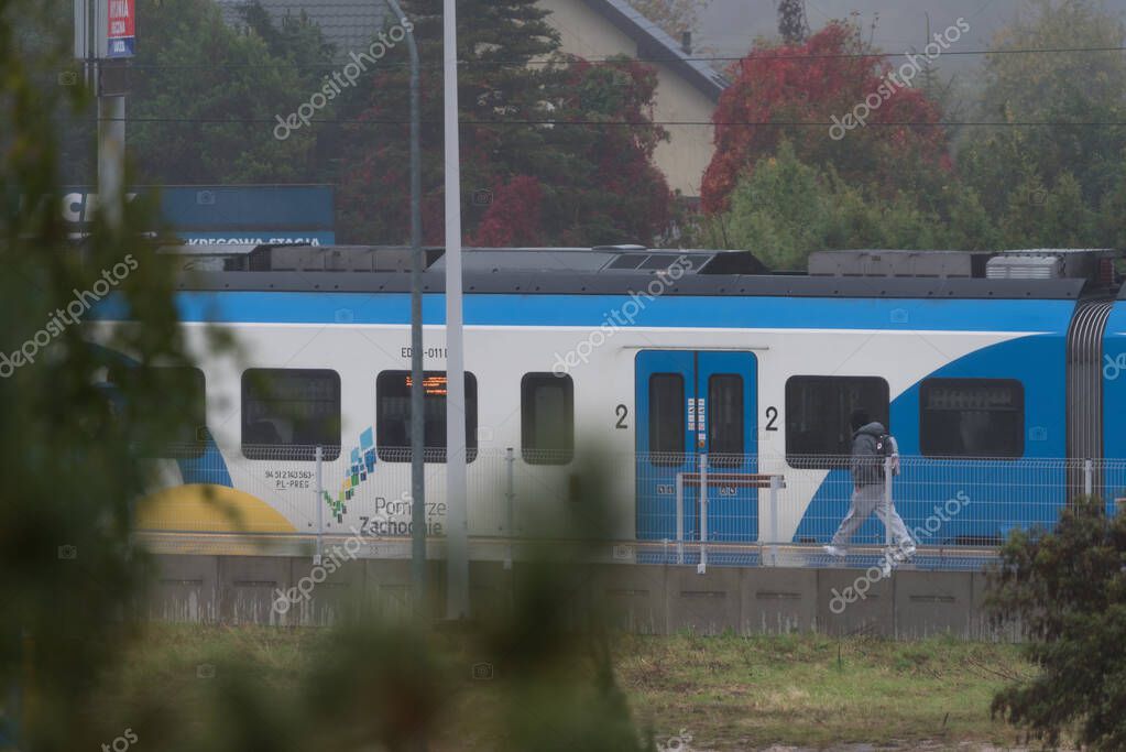 KOLOBRZEG, WEST POMERANIAN - POLAND - OCTOBER 12, 2025: Passenger train at the local railway station