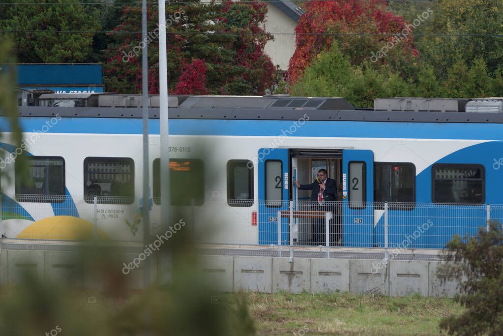 KOLOBRZEG, WEST POMERANIAN - POLAND - OCTOBER 12, 2025: Passenger train at the local railway station