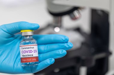 Laboratuvarda Coronavirus aşısı COVID-19 'un geliştirilmesi ve üretilmesi. Laboratuvarda Covid-19 aşısı.)
