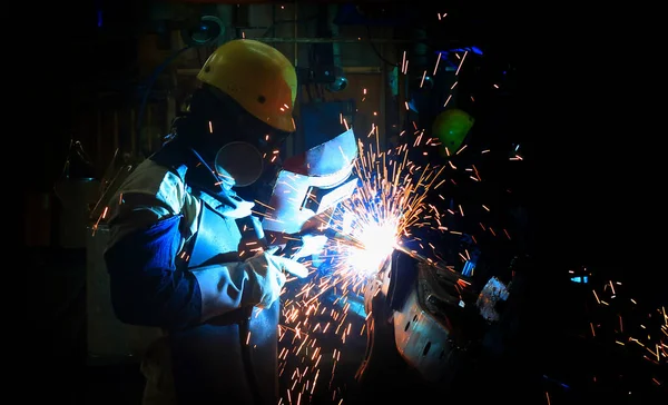 production welding engineer  with  in smart factory background. Mixed media of welding  in the automotive parts industry