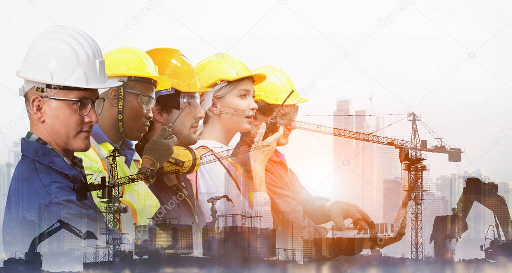 Group of architects and engineers at a building site , Team of expert architects on construciton site in helmets checking workflow