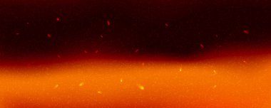 Abstract fiery background with glowing orange flames and rising sparks in a dark atmosphere.