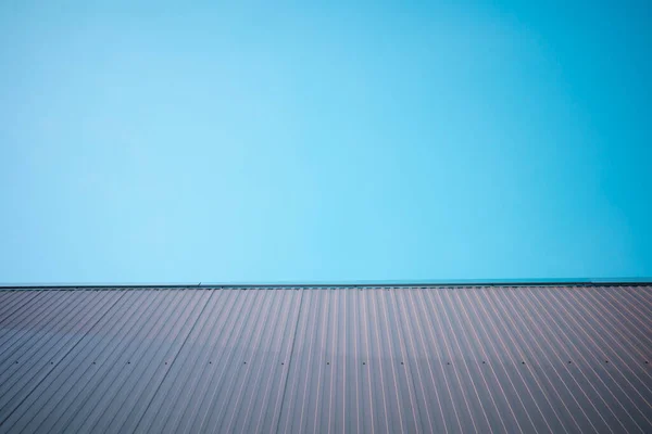 Geometry design bulding  aluminium roof corner with clear blue sky background. copy space