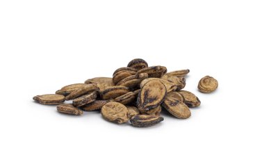 Kurumuş karpuz tohumları katı beyaz bir yüzey üzerinde küçük bir yığın oluşturur.